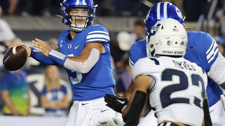 Sep 29, 2022; Provo, Utah, USA;  Brigham Young Cougars quarterback Jaren Hall (3) drops back to pass in the second quarter against the Utah State Aggies at LaVell Edwards Stadium. Mandatory Credit: Rob Gray-USA TODAY Sports