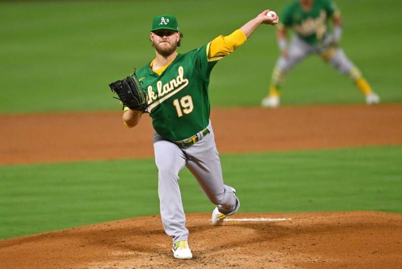Sep 29, 2022; Anaheim, California, USA; Oakland Athletics starting pitcher Cole Irvin (19) throws to the plate in the first inning against the Los Angeles Angels at Angel Stadium. Mandatory Credit: Jayne Kamin-Oncea-USA TODAY Sports