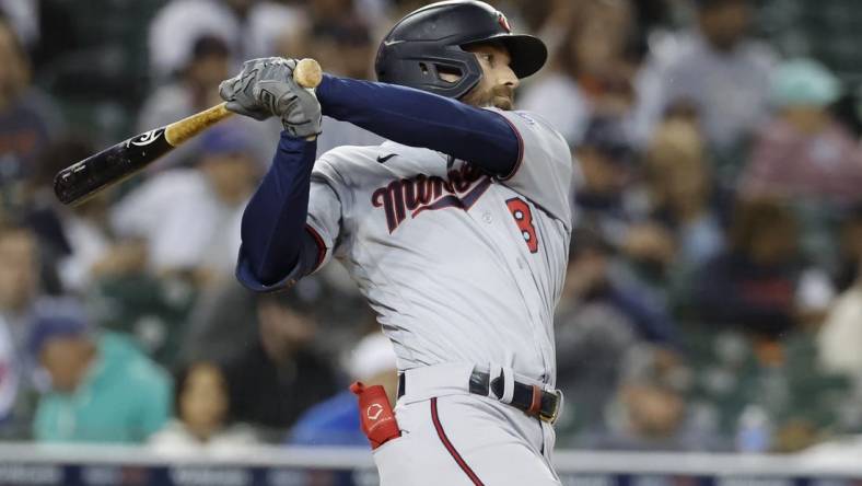 Sep 30, 2022; Detroit, Michigan, USA; Minnesota Twins left fielder Jake Cave (8) hits an RBI single in the fourth inning against the Detroit Tigers at Comerica Park. Mandatory Credit: Rick Osentoski-USA TODAY Sports