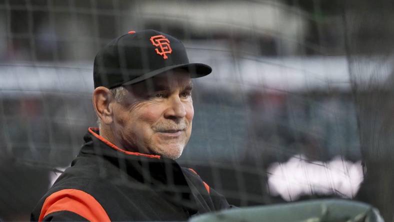 Apr 9, 2019; San Francisco, CA, USA; San Francisco Giants manager Bruce Bochy (15) smiles from the dugout during the second inning against the San Diego Padres at Oracle Park. Mandatory Credit: Kelley L Cox-USA TODAY Sports