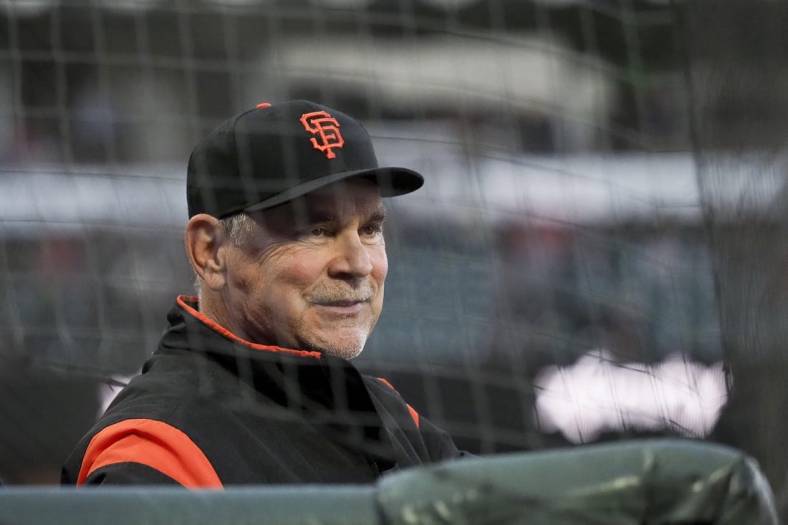 Apr 9, 2019; San Francisco, CA, USA; San Francisco Giants manager Bruce Bochy (15) smiles from the dugout during the second inning against the San Diego Padres at Oracle Park. Mandatory Credit: Kelley L Cox-USA TODAY Sports
