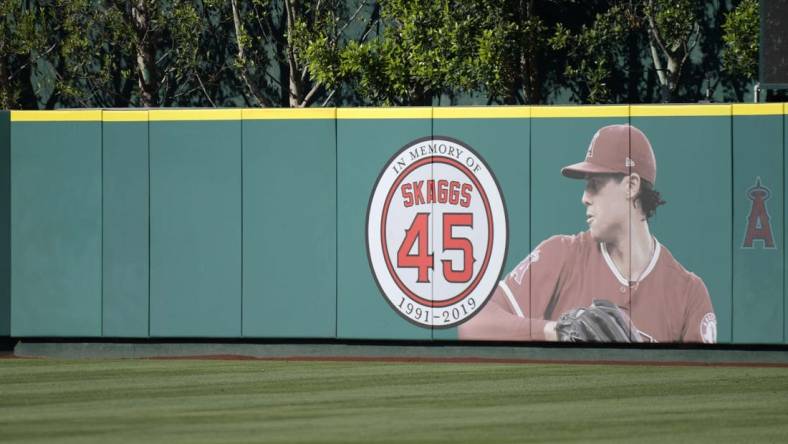 Jul 17, 2019; Anaheim, CA, USA; Detailed view of a memorial for Los Angeles Angels pitcher Tyler Skaggs on the outfield wall  at Angel Stadium of Anaheim. Skaggs, 27, died at a hotel in Southlake, Texas, July 1, 2019, where he was found unresponsive prior to a game against the Texas Rangers. Mandatory Credit: Kirby Lee-USA TODAY Sports