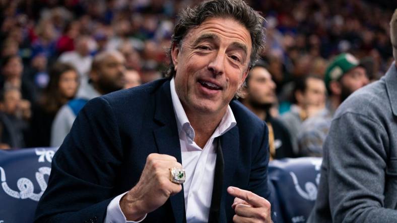 Jan 9, 2020; Philadelphia, Pennsylvania, USA; Boston Celtics owner Wyc Grousbeck points to his championship ring from the sidelines during the first quarter of the game against the Philadelphia 76ers at Wells Fargo Center. Mandatory Credit: Bill Streicher-USA TODAY Sports