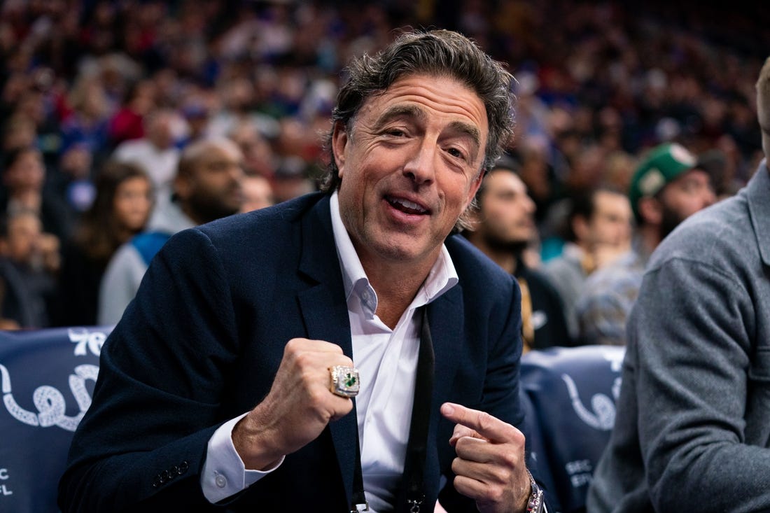 Jan 9, 2020; Philadelphia, Pennsylvania, USA; Boston Celtics owner Wyc Grousbeck points to his championship ring from the sidelines during the first quarter of the game against the Philadelphia 76ers at Wells Fargo Center. Mandatory Credit: Bill Streicher-USA TODAY Sports