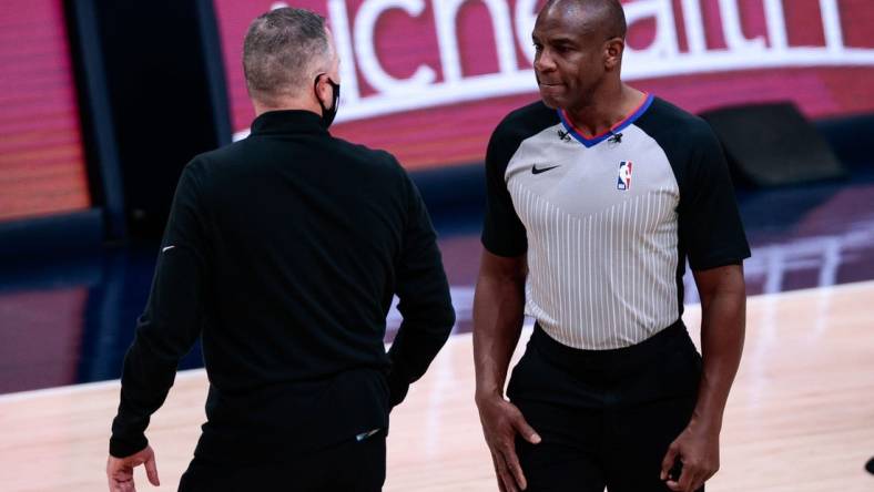 Dec 23, 2020; Denver, Colorado, USA; Denver Nuggets head coach Michael Malone (L) argues a call with referee Tony Brown (R) in the first quarter against the Sacramento Kings at Ball Arena. Mandatory Credit: Isaiah J. Downing-USA TODAY Sports