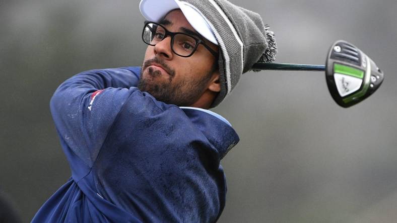 Feb 13, 2021; Pebble Beach, California, USA; Akshay Bhatia plays his shot from the first tee during the third round of the AT&T Pebble Beach Pro-Am golf tournament at Pebble Beach Golf Links. Mandatory Credit: Orlando Ramirez-USA TODAY Sports