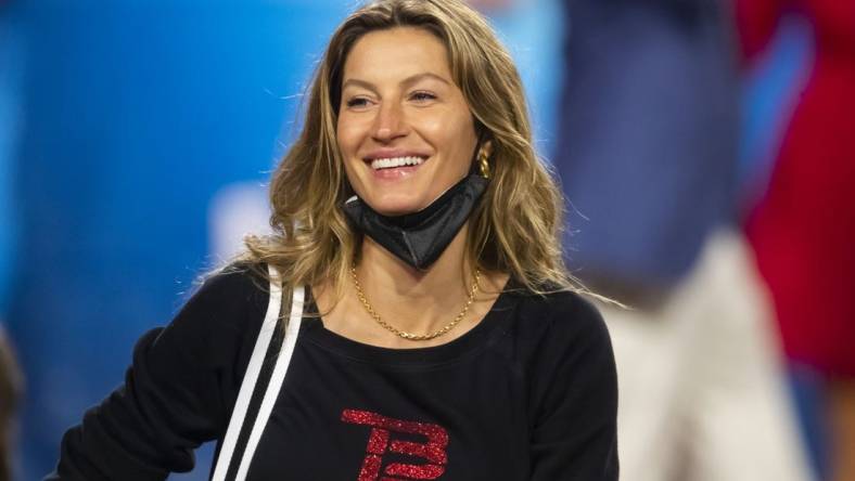 Feb 7, 2021; Tampa, FL, USA;  Gisele Bundchen, wife of Tampa Bay Buccaneers quarterback Tom Brady (not pictured) celebrates after defeating the Kansas City Chiefs in Super Bowl LV at Raymond James Stadium.  Mandatory Credit: Mark J. Rebilas-USA TODAY Sports