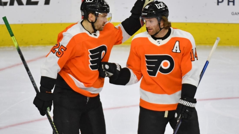 May 10, 2021; Philadelphia, Pennsylvania, USA; Philadelphia Flyers left wing James van Riemsdyk (25) celebrates his goal with center Sean Couturier (14) against the New Jersey Devils during the third period at Wells Fargo Center. Mandatory Credit: Eric Hartline-USA TODAY Sports
