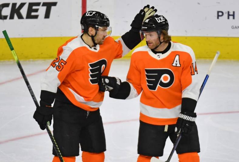 May 10, 2021; Philadelphia, Pennsylvania, USA; Philadelphia Flyers left wing James van Riemsdyk (25) celebrates his goal with center Sean Couturier (14) against the New Jersey Devils during the third period at Wells Fargo Center. Mandatory Credit: Eric Hartline-USA TODAY Sports