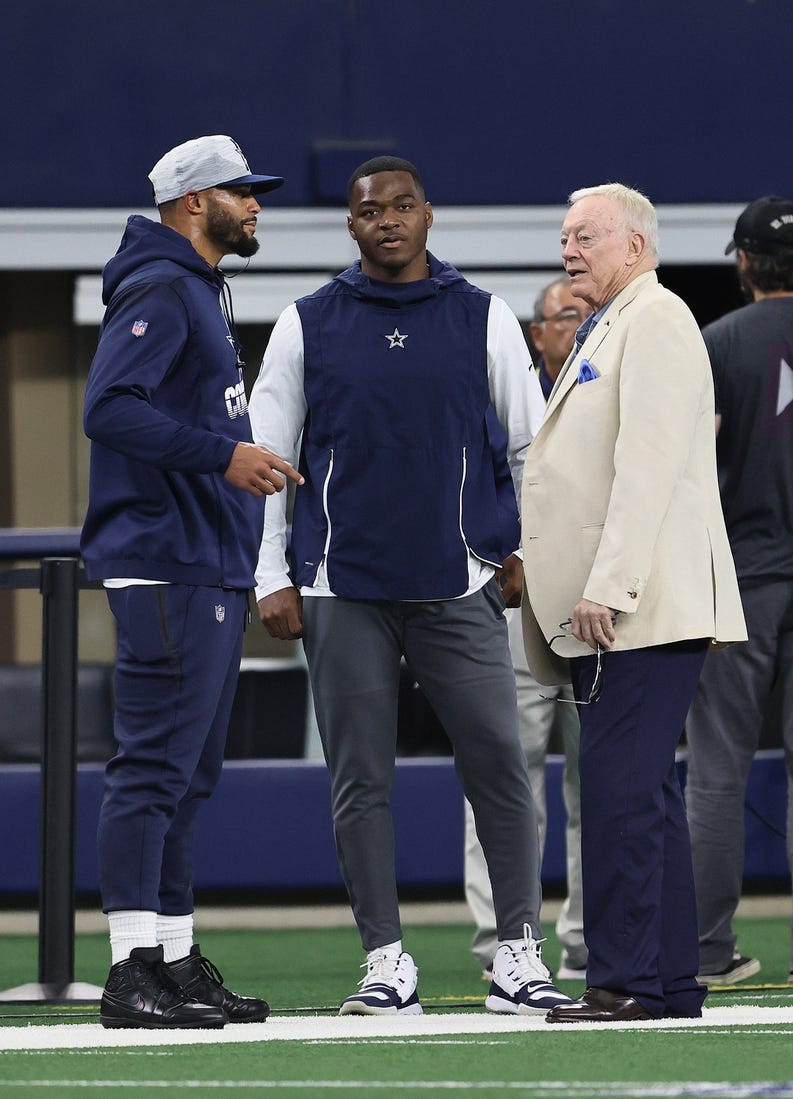 Aug 29, 2021; Arlington, Texas, USA; Dallas Cowboys quarterback Dak Prescott , owner Jerry Jones and receiver Amari Cooper talk prior to the game against the Jacksonville Jaguars at AT&T Stadium. Mandatory Credit: Matthew Emmons-USA TODAY Sports