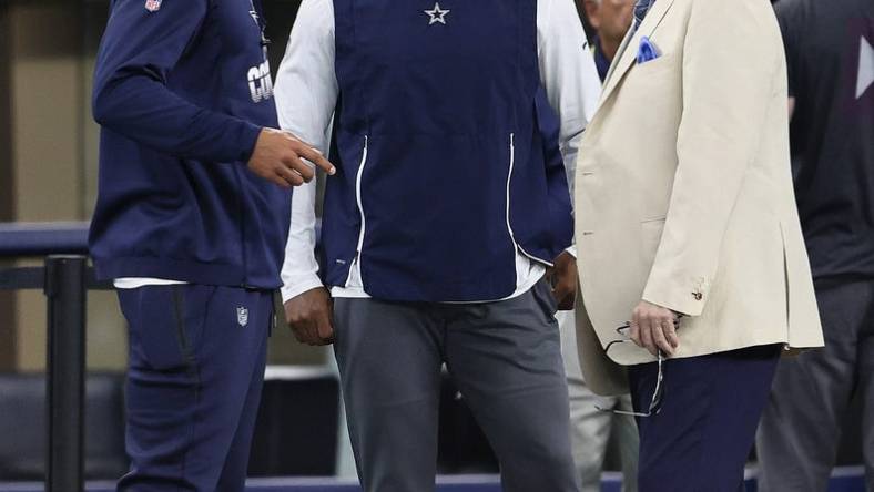 Aug 29, 2021; Arlington, Texas, USA; Dallas Cowboys quarterback Dak Prescott , owner Jerry Jones and receiver Amari Cooper talk prior to the game against the Jacksonville Jaguars at AT&T Stadium. Mandatory Credit: Matthew Emmons-USA TODAY Sports