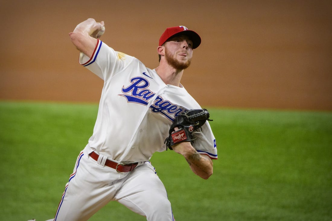 Sep 28, 2021; Arlington, Texas, USA; Texas Rangers starting pitcher A.J. Alexy (62) pitches against the Los Angeles Angels during the first inning at Globe Life Field. Mandatory Credit: Jerome Miron-USA TODAY Sports