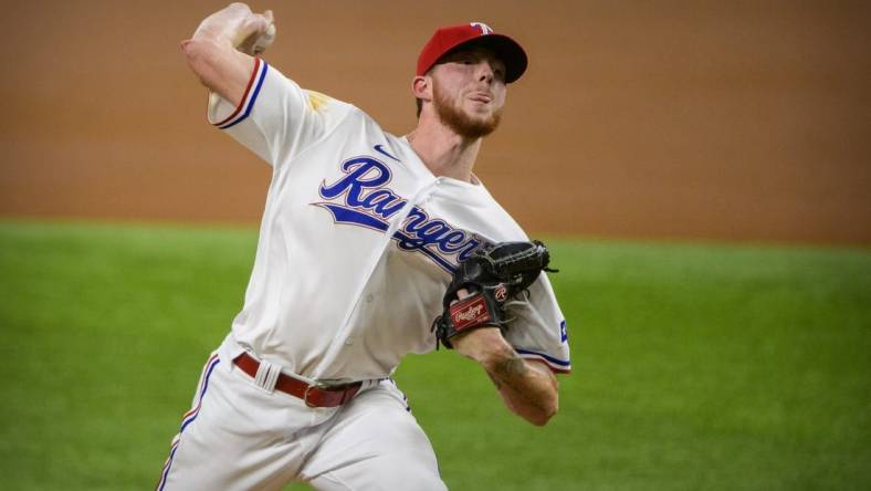 Sep 28, 2021; Arlington, Texas, USA; Texas Rangers starting pitcher A.J. Alexy (62) pitches against the Los Angeles Angels during the first inning at Globe Life Field. Mandatory Credit: Jerome Miron-USA TODAY Sports