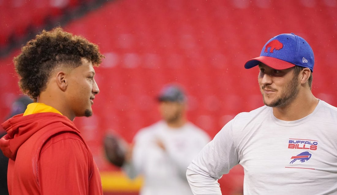 Oct 10, 2021; Kansas City, Missouri, USA; Kansas City Chiefs quarterback Patrick Mahomes (15) talks with Buffalo Bills quarterback Josh Allen (17) before warm ups at GEHA Field at Arrowhead Stadium. Mandatory Credit: Denny Medley-USA TODAY Sports