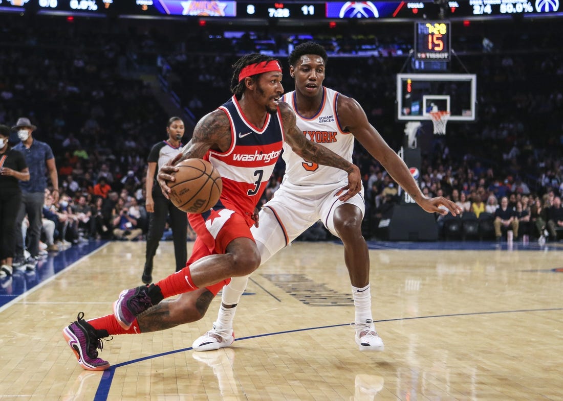 Oct 15, 2021; New York, New York, USA;  Washington Wizards guard Bradley Beal (3) drives past New York Knicks guard RJ Barrett (9) in the second quarter at Madison Square Garden. Mandatory Credit: Wendell Cruz-USA TODAY Sports