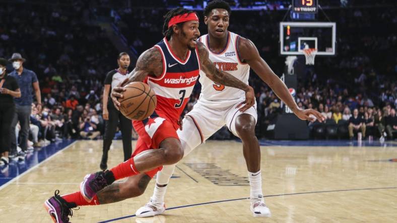 Oct 15, 2021; New York, New York, USA;  Washington Wizards guard Bradley Beal (3) drives past New York Knicks guard RJ Barrett (9) in the second quarter at Madison Square Garden. Mandatory Credit: Wendell Cruz-USA TODAY Sports