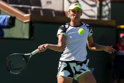 Elise Mertens of Belgium keeps her eyes on the ball to return while playing with doubles partner Su-Wei Hsieh of Taiwan against Veronika Kudermetova of Russia and Elena Rybakina of Kazakhstan during the women's doubles final of the BNP Paribas Open at the Indian Wells Tennis Garden, Saturday, Oct. 16, 2021, in Indian Wells, Calif.
