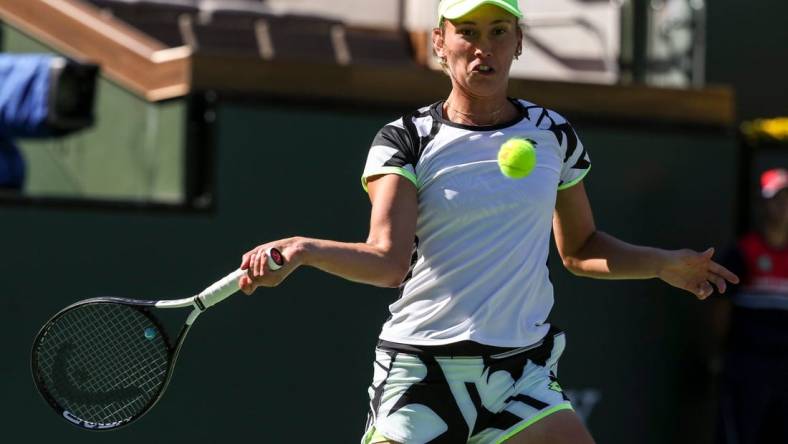 Elise Mertens of Belgium keeps her eyes on the ball to return while playing with doubles partner Su-Wei Hsieh of Taiwan against Veronika Kudermetova of Russia and Elena Rybakina of Kazakhstan during the women's doubles final of the BNP Paribas Open at the Indian Wells Tennis Garden, Saturday, Oct. 16, 2021, in Indian Wells, Calif.