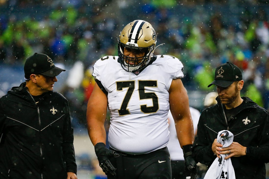 Oct 25, 2021; Seattle, Washington, USA; New Orleans Saints guard Andrus Peat (75) walks to the sideline following an injury during the second quarter against the Seattle Seahawks at Lumen Field. Mandatory Credit: Joe Nicholson-USA TODAY Sports