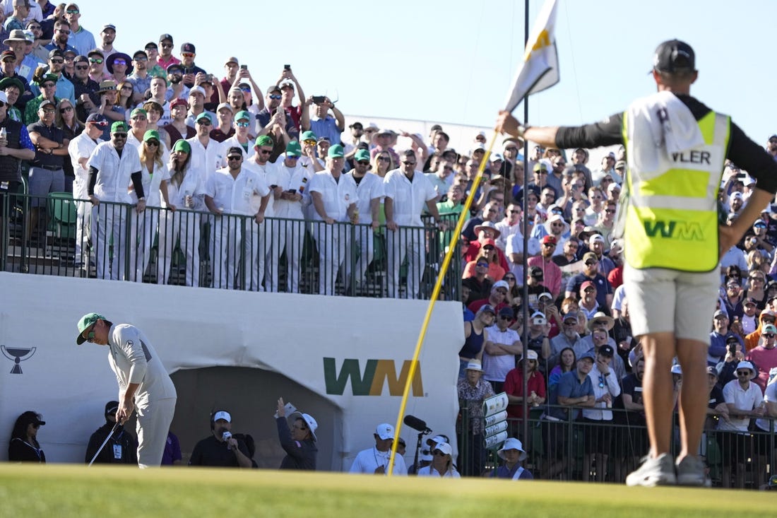 Feb 11, 2022; Scottsdale, Arizona, USA;  Rickie Fowler putts on the 16th green during Round 2 of the WM Phoenix Open at TPC Scottsdale.

Pga Phoenix Open