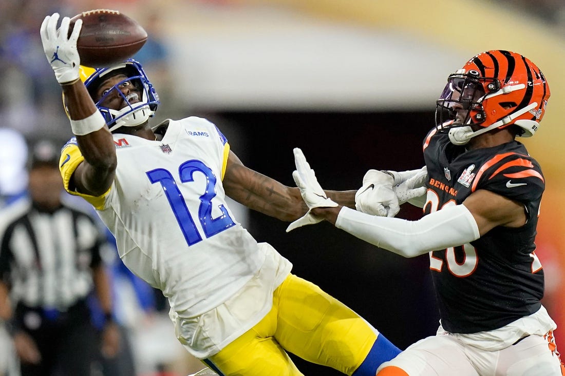 Los Angeles Rams wide receiver Van Jefferson (12) stretches for a pass before it lands incomplete under pressure from Cincinnati Bengals cornerback Eli Apple (20) in the fourth quarter of Super Bowl 56 between the Cincinnati Bengals and the Los Angeles Rams at SoFi Stadium in Inglewood, Calif., on Sunday, Feb. 13, 2022. The Rams came back in the final minutes of the game to win 23-20 on their home field.

Super Bowl 56 Cincinnati Bengals Vs La Rams