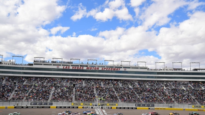 March 6, 2022;  Las Vegas, Nevada, USA;  NASCAR Cup Series driver Kyle Busch (18) leads during the Pennsyl 400 at Las Vegas Motor Speedway.  Mandatory credit: Gary A. Vasquez-USA TODAY Sports