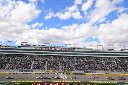 Mar 6, 2022; Las Vegas, Nevada, USA; NASCAR Cup Series driver Kyle Busch (18) leads during the Pennzoil 400 at Las Vegas Motor Speedway. Mandatory Credit: Gary A. Vasquez-USA TODAY Sports