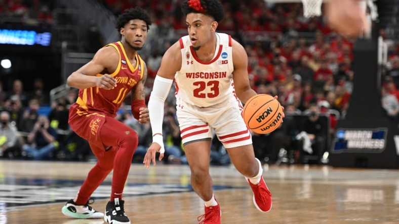 Mar 20, 2022; Milwaukee, WI, USA; Wisconsin Badgers guard Chucky Hepburn (23) drives to the basket against I11 during the first half during the second round of the 2022 NCAA Tournament at Fiserv Forum. Mandatory Credit: Benny Sieu-USA TODAY Sports