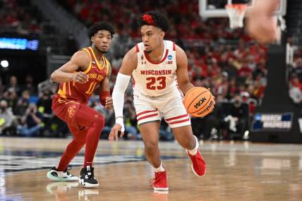 Mar 20, 2022; Milwaukee, WI, USA; Wisconsin Badgers guard Chucky Hepburn (23) drives to the basket against I11 during the first half during the second round of the 2022 NCAA Tournament at Fiserv Forum. Mandatory Credit: Benny Sieu-USA TODAY Sports