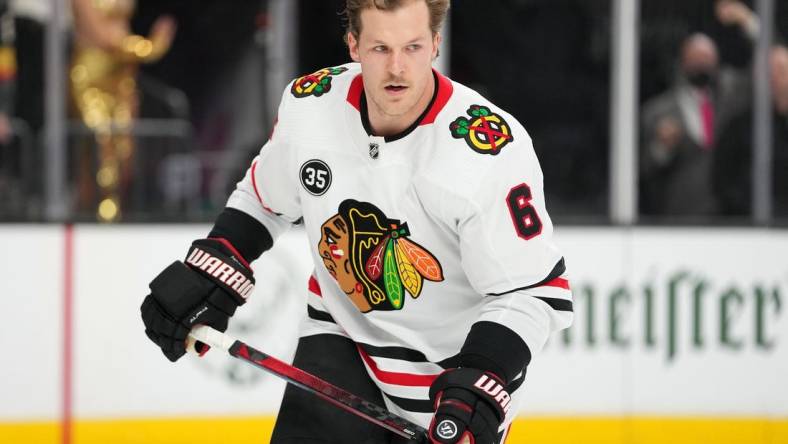 Mar 26, 2022; Las Vegas, Nevada, USA; Chicago Blackhawks defenseman Jake McCabe (6) warms up before a game against the Vegas Golden Knights at T-Mobile Arena. Mandatory Credit: Stephen R. Sylvanie-USA TODAY Sports