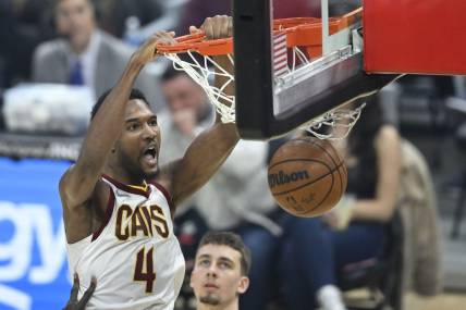 Mar 28, 2022; Cleveland, Ohio, USA; Cleveland Cavaliers center Evan Mobley (4) dunks in the first quarter against the Orlando Magic at Rocket Mortgage FieldHouse. Mandatory Credit: David Richard-USA TODAY Sports