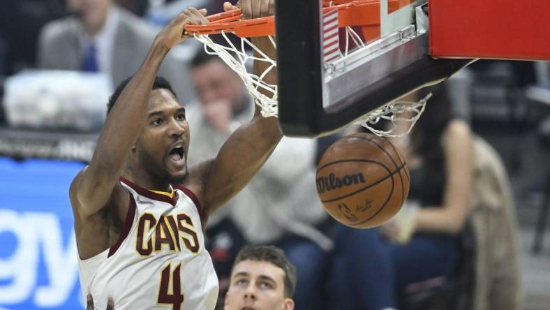 Mar 28, 2022; Cleveland, Ohio, USA; Cleveland Cavaliers center Evan Mobley (4) dunks in the first quarter against the Orlando Magic at Rocket Mortgage FieldHouse. Mandatory Credit: David Richard-USA TODAY Sports