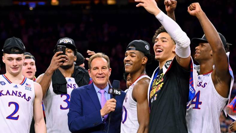 Apr 4, 2022; New Orleans, LA, USA; CBS announcer Jim Nantz interviews Kansas Jayhawks guard Ochai Agbaji (30) after their win against the North Carolina Tar Heels in the 2022 NCAA men's basketball tournament Final Four championship game at Caesars Superdome. Mandatory Credit: Bob Donnan-USA TODAY Sports