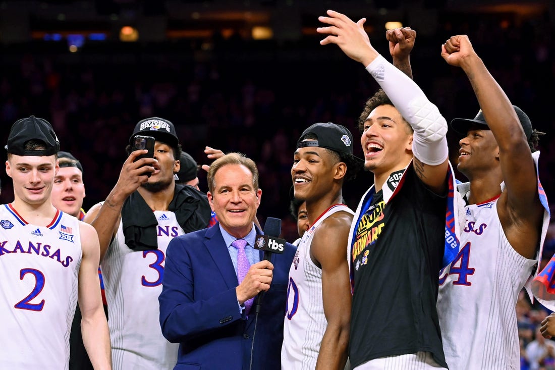 Apr 4, 2022; New Orleans, LA, USA; CBS announcer Jim Nantz interviews Kansas Jayhawks guard Ochai Agbaji (30) after their win against the North Carolina Tar Heels in the 2022 NCAA men's basketball tournament Final Four championship game at Caesars Superdome. Mandatory Credit: Bob Donnan-USA TODAY Sports