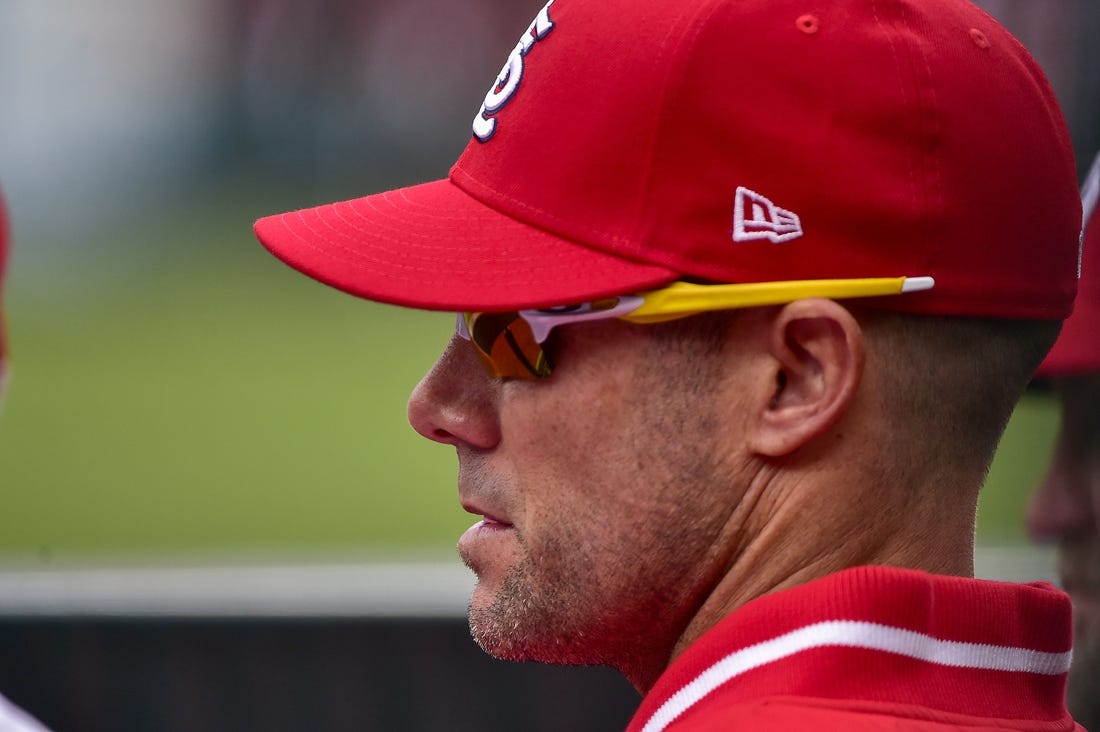 Apr 7, 2022; St. Louis, Missouri, USA;  St. Louis Cardinals bench coach Skip Schumaker (55) looks on from the dugout during the sixth inning of Opening Day against the Pittsburgh Pirates at Busch Stadium. Mandatory Credit: Jeff Curry-USA TODAY Sports