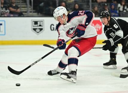 Apr 16, 2022; Los Angeles, California, USA;   Columbus Blue Jackets left wing Patrik Laine (29) skates the puck past Los Angeles Kings defenseman Olli Maatta (6) in the third period at Crypto.com Arena. Mandatory Credit: Jayne Kamin-Oncea-USA TODAY Sports