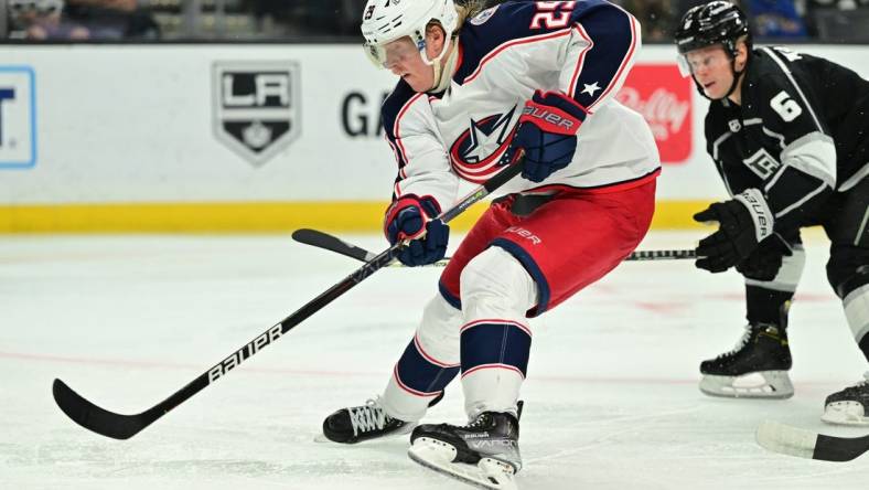 Apr 16, 2022; Los Angeles, California, USA;   Columbus Blue Jackets left wing Patrik Laine (29) skates the puck past Los Angeles Kings defenseman Olli Maatta (6) in the third period at Crypto.com Arena. Mandatory Credit: Jayne Kamin-Oncea-USA TODAY Sports