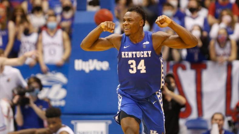 Kentucky forward Oscar Tshiebwe (34) flexes after scoring over Kansas during the second half of Saturday's game inside Allen Fieldhouse.

Oscar Tshiebwe Kansas