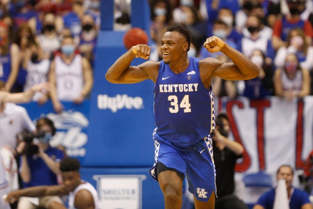 Kentucky forward Oscar Tshiebwe (34) flexes after scoring over Kansas during the second half of Saturday's game inside Allen Fieldhouse.

Oscar Tshiebwe Kansas