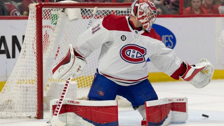 Apr 23, 2022; Ottawa, Ontario, CAN; Montreal Canadiens goalie Carey Price (31) is unable to stop a shot from Ottawa Senators center Josh Norris (not pictured) in the second period at the Canadian Tire Centre. Mandatory Credit: Marc DesRosiers-USA TODAY Sports