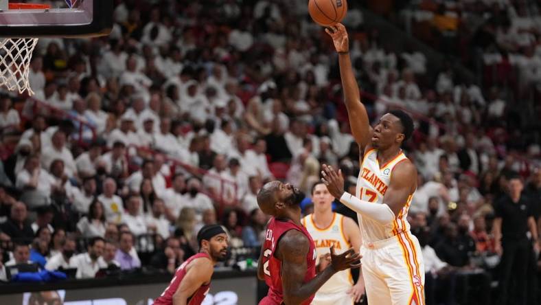 Apr 26, 2022; Miami, Florida, USA; Atlanta Hawks forward Onyeka Okongwu (17) puts up a shot over Miami Heat center Dewayne Dedmon (21) during the first half in game five of the first round for the 2022 NBA playoffs at FTX Arena. Mandatory Credit: Jasen Vinlove-USA TODAY Sports