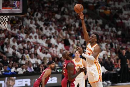 Apr 26, 2022; Miami, Florida, USA; Atlanta Hawks forward Onyeka Okongwu (17) puts up a shot over Miami Heat center Dewayne Dedmon (21) during the first half in game five of the first round for the 2022 NBA playoffs at FTX Arena. Mandatory Credit: Jasen Vinlove-USA TODAY Sports