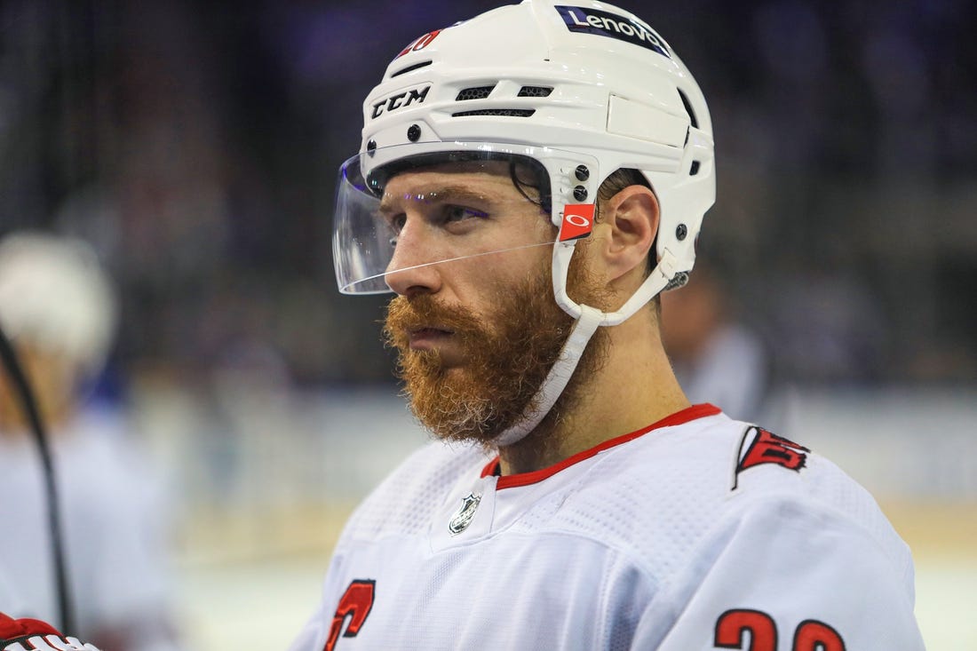 May 24, 2022; New York, New York, USA; Carolina Hurricanes defenseman Ian Cole (28) talks with coaches during the third period against the New York Rangers in game four of the second round of the 2022 Stanley Cup Playoffs at Madison Square Garden. Mandatory Credit: Danny Wild-USA TODAY Sports