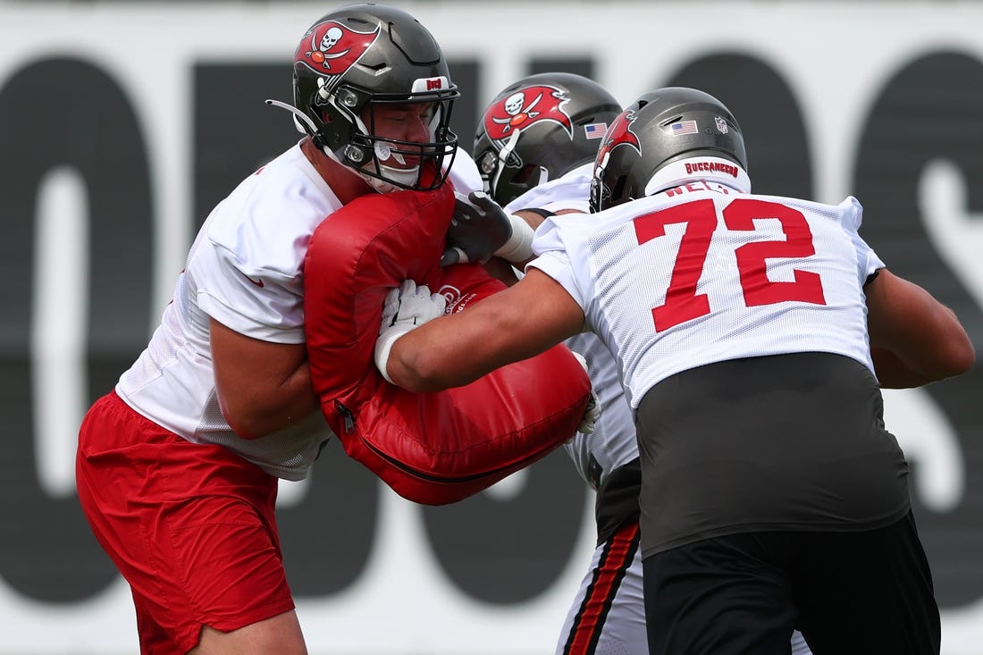 May 25, 2022; Tampa, FL, USA;  Tampa Bay Buccaneers  guard Luke Goedeke (67) (left) and tackle Josh Wells (72) participate in organized team activities at AdventHealth Training Center Mandatory Credit: Nathan Ray Seebeck-USA TODAY Sports
