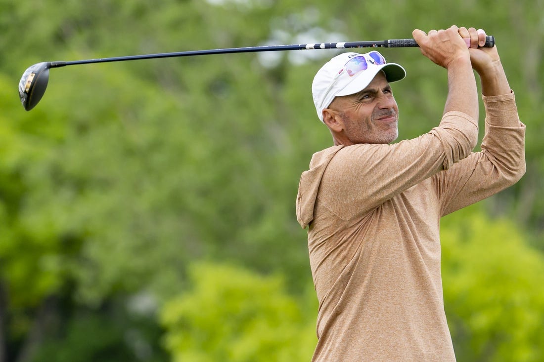 May 26, 2022; Benton Harbor, Michigan, USA; Rocco Mediate hits his tee shot on the eighth hole during the first round of the 2022 KitchenAid Senior PGA Championship at Harbor Shores. Mandatory Credit: Raj Mehta-USA TODAY Sports