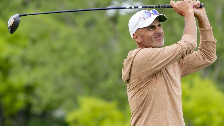 May 26, 2022; Benton Harbor, Michigan, USA; Rocco Mediate hits his tee shot on the eighth hole during the first round of the 2022 KitchenAid Senior PGA Championship at Harbor Shores. Mandatory Credit: Raj Mehta-USA TODAY Sports