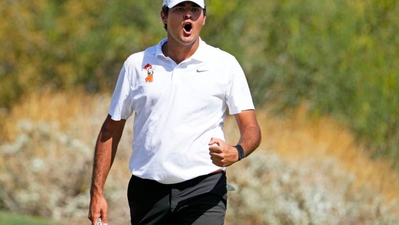 May 30, 2022; Scottsdale, Arizona, USA; Eugenio Lopez-Chacarra of Oklahoma State reacts after making his putt on the 10th hole during the final round of the NCAA DI Mens Golf Championship at Grayhawk Golf Club - Raptor Course. Mandatory Credit: Rob Schumacher-Arizona Republic

Golf Ncaa Di Mens Golf Championship