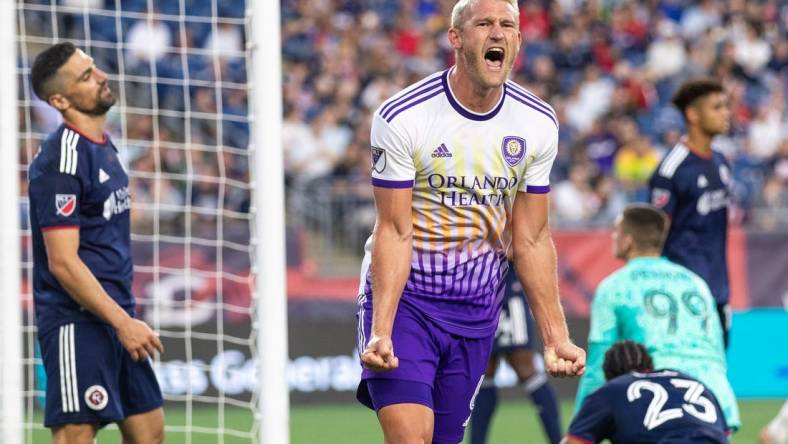 Jun 15, 2022; Foxborough, Massachusetts, USA; Orlando City SC defender Robin Jansson (6) celebrates after scoring a goal during the first half against the New England Revolution at Gillette Stadium. Mandatory Credit: Paul Rutherford-USA TODAY Sports