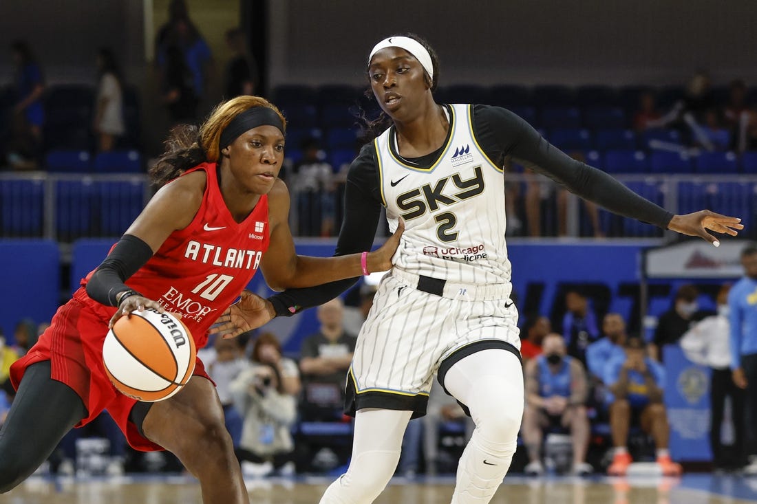 Jun 17, 2022; Chicago, Illinois, USA; Atlanta Dream guard Rhyne Howard (10) drives to the basket against Chicago Sky guard Kahleah Copper (2) during the first half of a WNBA game at Wintrust Arena. Mandatory Credit: Kamil Krzaczynski-USA TODAY Sports