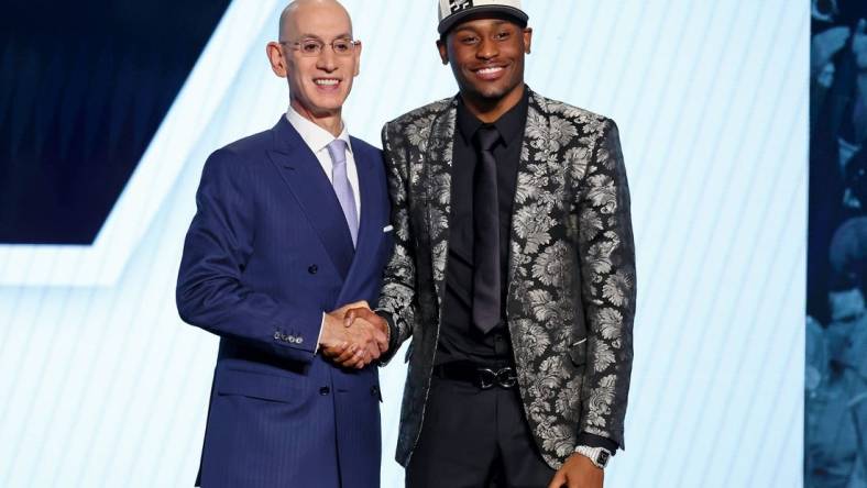 Jun 23, 2022; Brooklyn, NY, USA; Malaki Branham (Ohio State) shakes hands with NBA commissioner Adam Silver after being selected as the number twenty overall pick by the San Antonio Spurs in the first round of the 2022 NBA Draft at Barclays Center. Mandatory Credit: Brad Penner-USA TODAY Sports